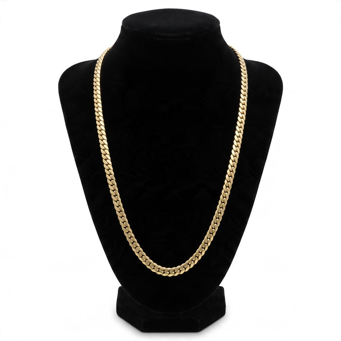 Cadena tipo Cartier de El Rey Joyero en oro laminado de 18k con eslabones cubanos clásicos sobre busto expositor negro.