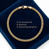 Pulsera tipo Mónaco de El Rey Joyero en oro laminado 18k de 5mm sobre estuche de terciopelo azul