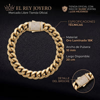 Pulso Mónaco de El Rey Joyero en oro laminado 18k con eslabones gruesos y broche pavé brillante sobre fondo negro.